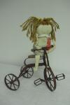 Doll on Tricycle